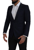 Manteau bleu en laine Dolce & Gabbana, blazer à un seul boutonnage, coupe élégante, tissu texturé, porté sur un mannequin.