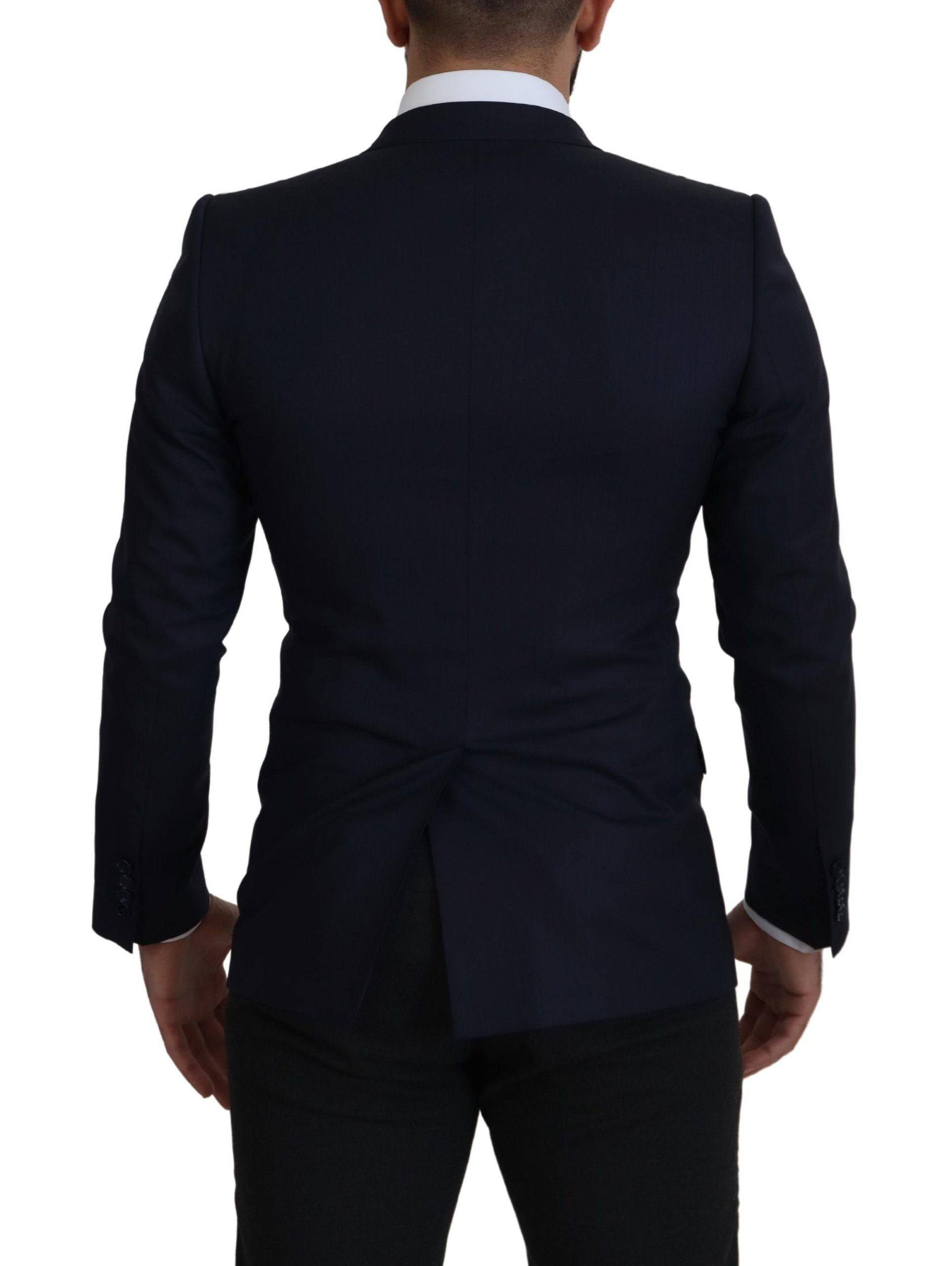 Blazer en laine bleue Dolce & Gabbana, manteau à boutonnière simple, coupe élégante et classique, porté sur un mannequin.