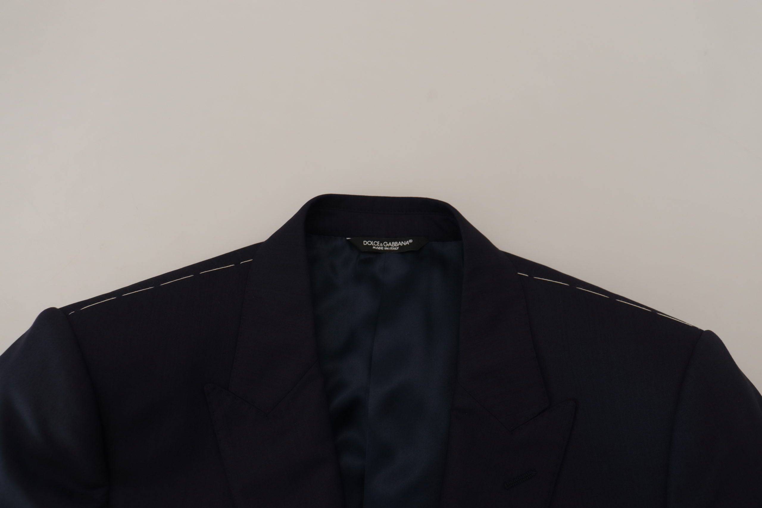 Manteau bleu en laine Dolce & Gabbana, blazer à boutonnières simple, coupe élégante, détails sophistiqués.