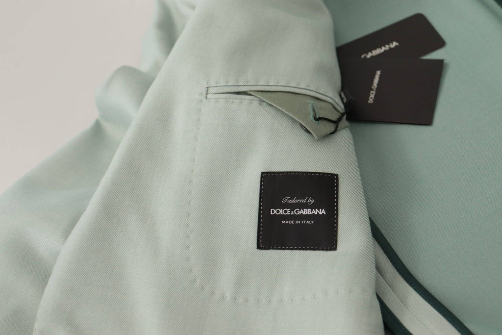 Veste blazer en cachemire vert de Dolce & Gabbana, élégante et raffinée, avec coupe sophistiquée et détails subtils.