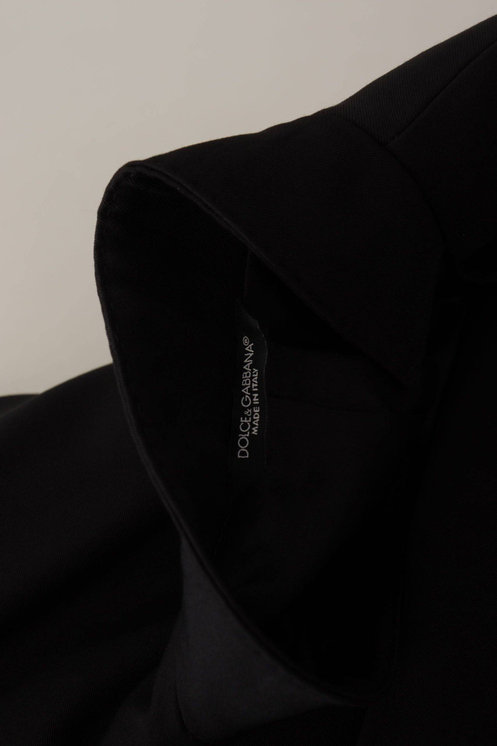 Veste blazer en laine noire Dolce & Gabbana à boutonnière simple, mode élégante et sophistiquée, vue de face.