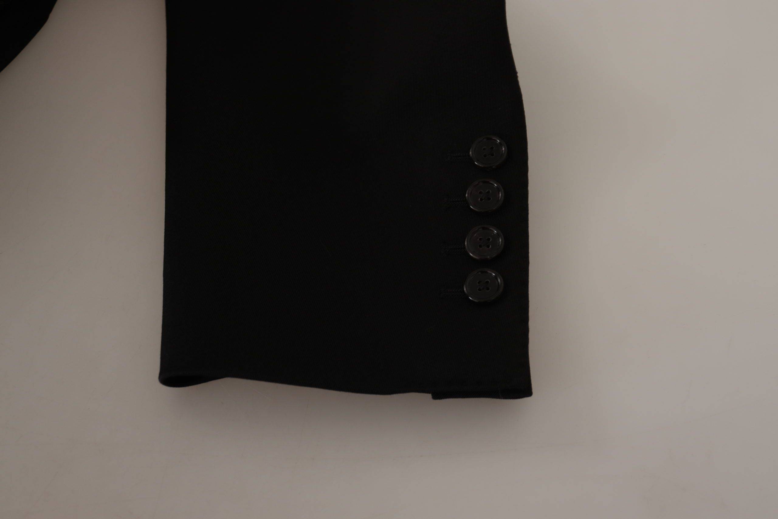 Veste blazer en laine noire Dolce & Gabbana à boutons simple breasted, élégante et sophistiquée.