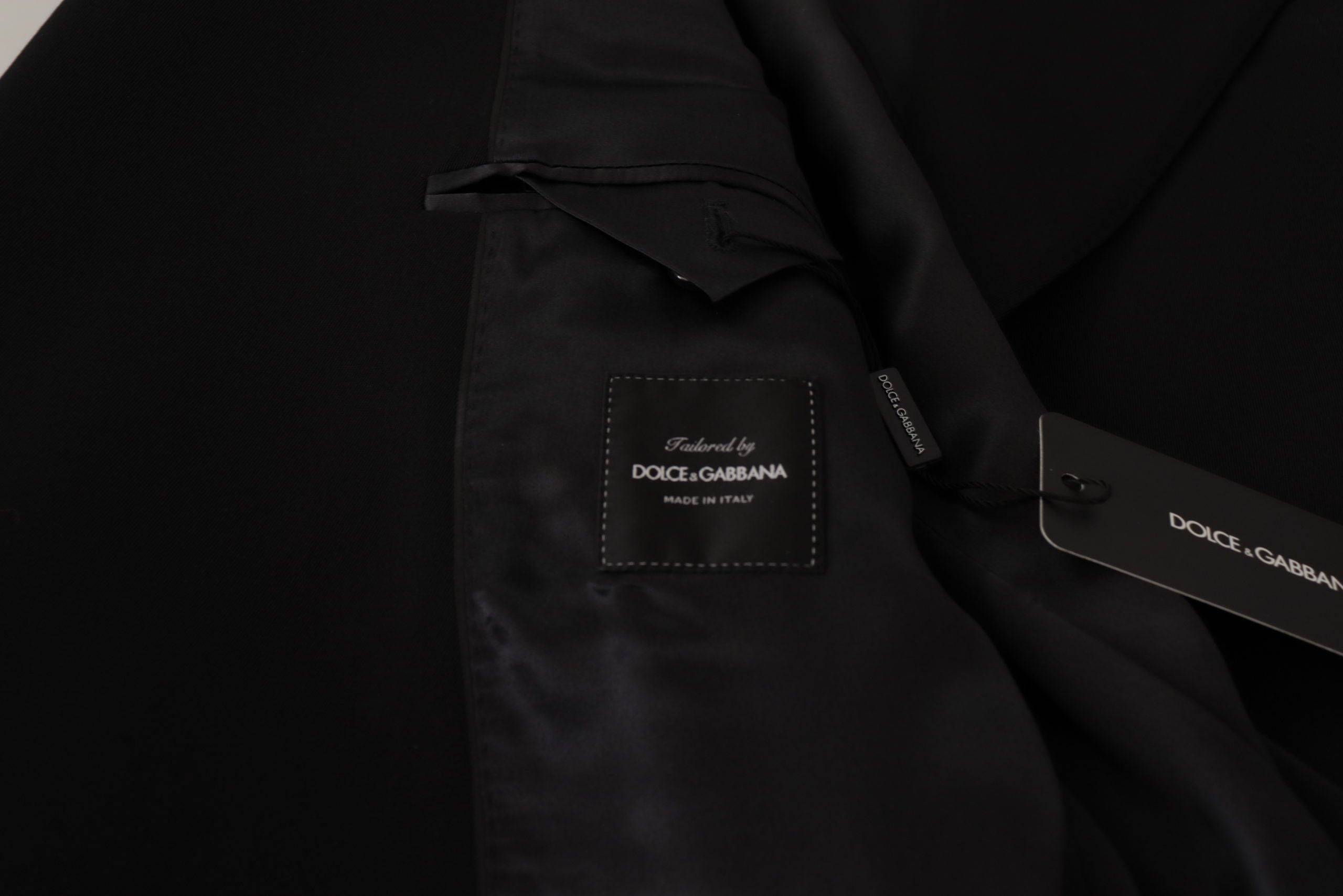 Veste blazer en laine noire Dolce & Gabbana à double boutonnage, élégante et sophistiquée, vue de face sur un mannequin.