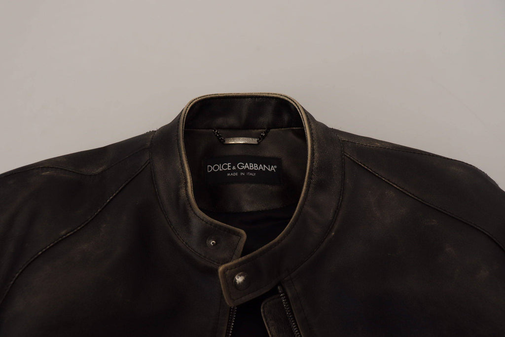 Veste en cuir noir Dolce & Gabbana, style blouson biker avec fermeture éclair, détails modernes et élégants.