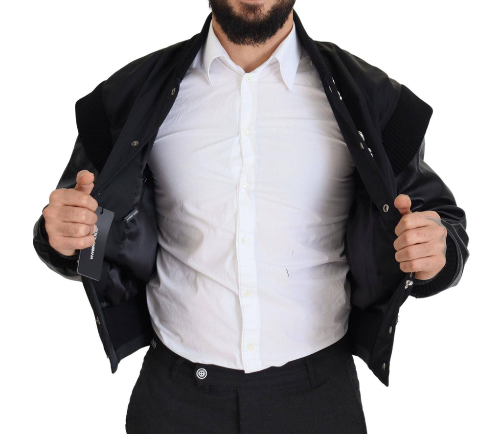 Veste en nylon noir Dolce & Gabbana avec boutons ornés de cristaux, élégante et sophistiquée, vue de face.
