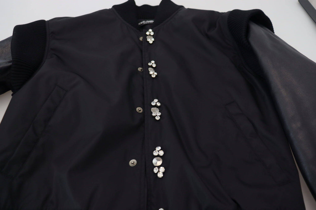 Veste noire en nylon Dolce & Gabbana avec boutons en cristal, élégante et tendance, visible en gros plan.