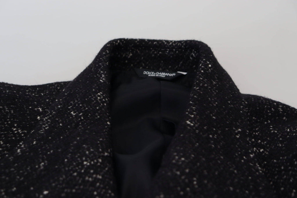 Manteau noir en laine Dolce & Gabbana pour homme, double-breasted, style élégant et chaud, porté en veste.