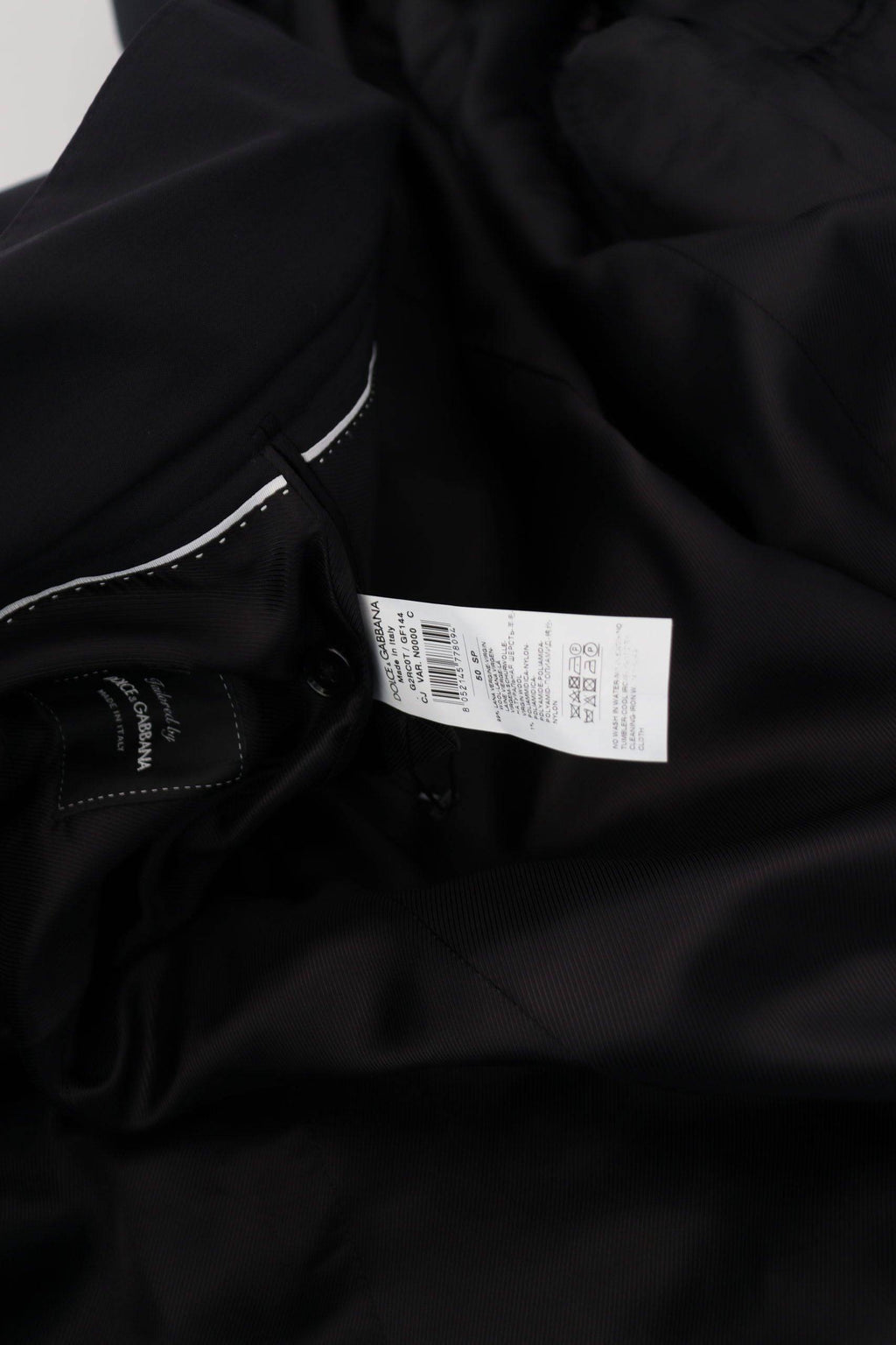 Veste en laine noire Dolce & Gabbana à manches longues et zip intégral, élégante et sophistiquée, vue de face.