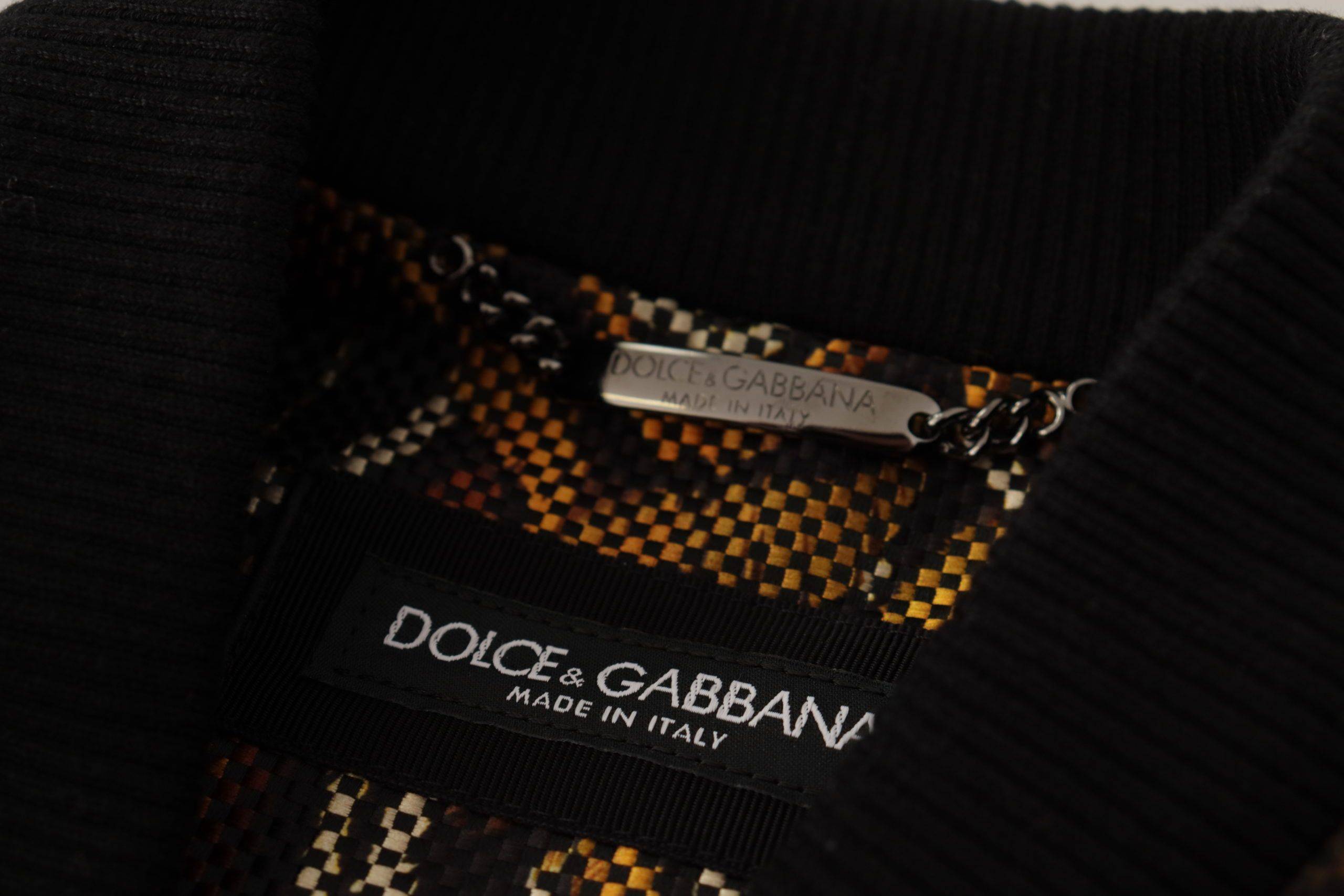 Veste blouson marron Dolce & Gabbana avec fermeture éclair complète et détails en plumes.