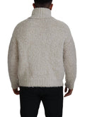 Pull en laine crème Dolce & Gabbana à col roulé, pull-over élégant en tricot chaud et doux, porté sur fond neutre.