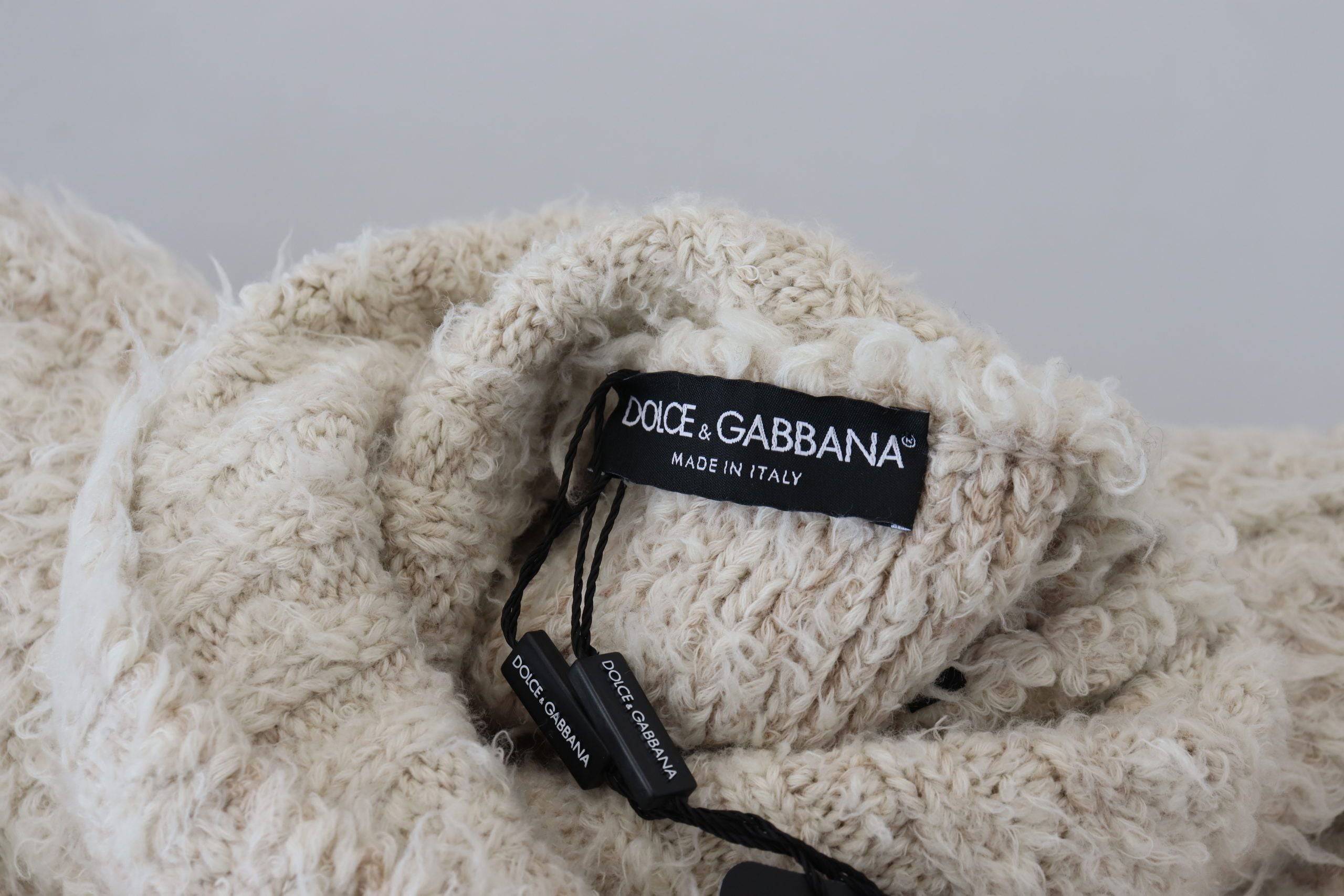 Pull en cachemire gris Dolce & Gabbana à col roulé, tricoté en laine douce, style élégant et confortable.