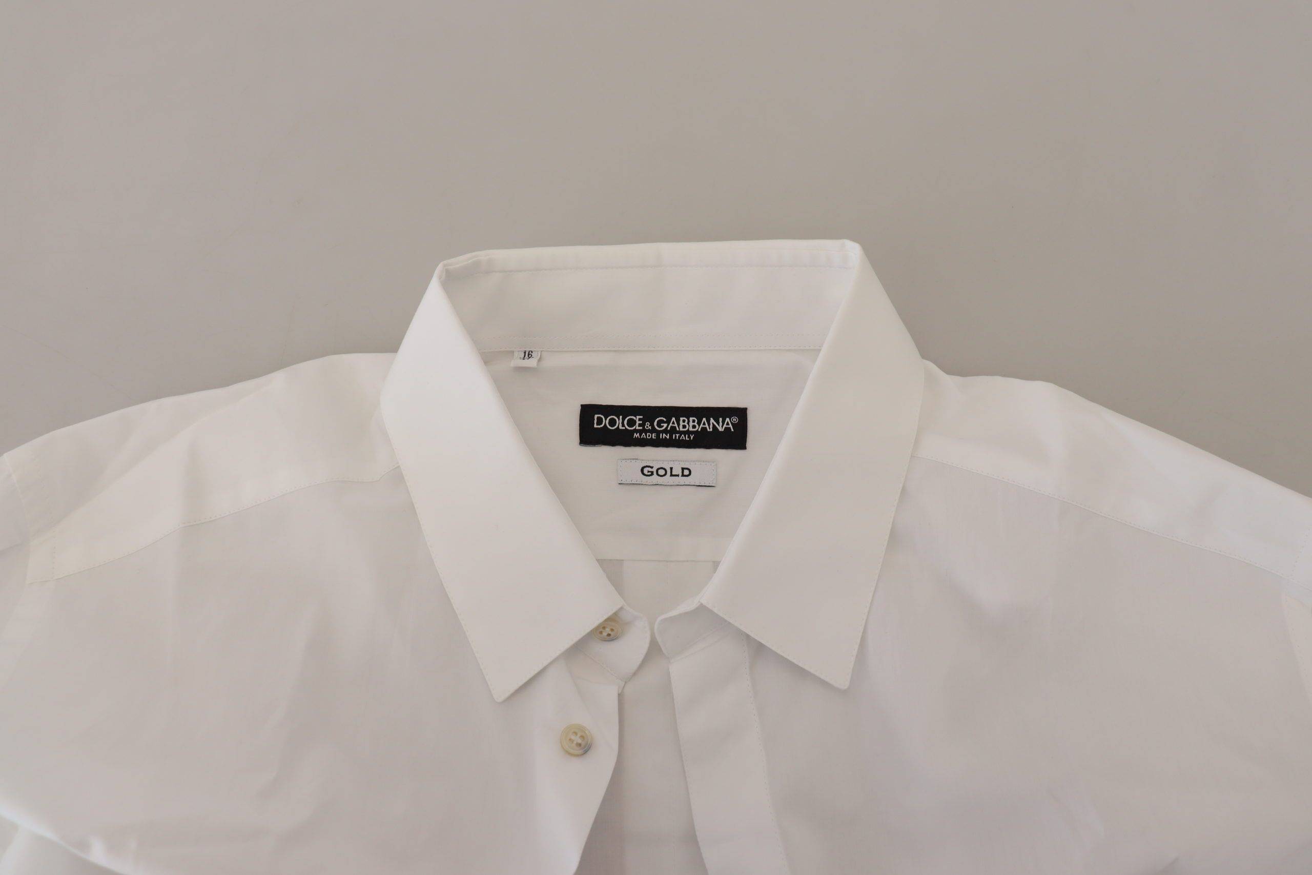 Chemise formelle blanche en coton Dolce & Gabbana avec motif de paon doré, élégance et style sophistiqué.