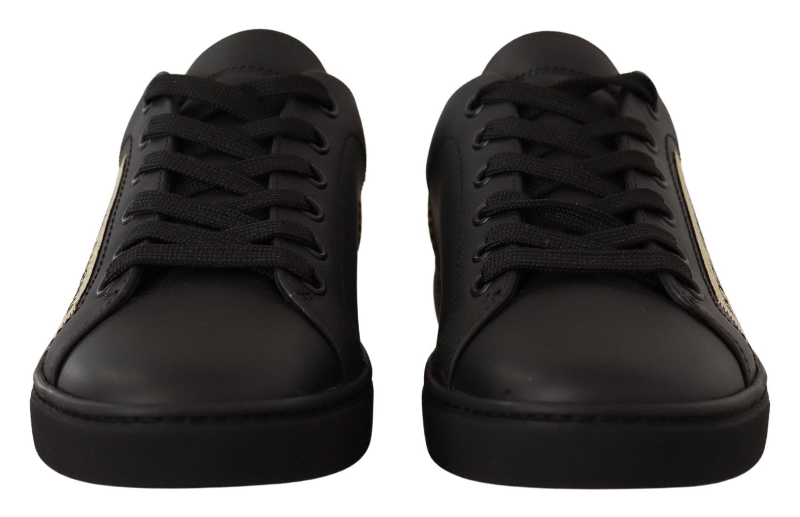 Chaussures basses pour femmes Dolce & Gabbana en cuir noir avec détails dorés, baskets élégantes et tendance.