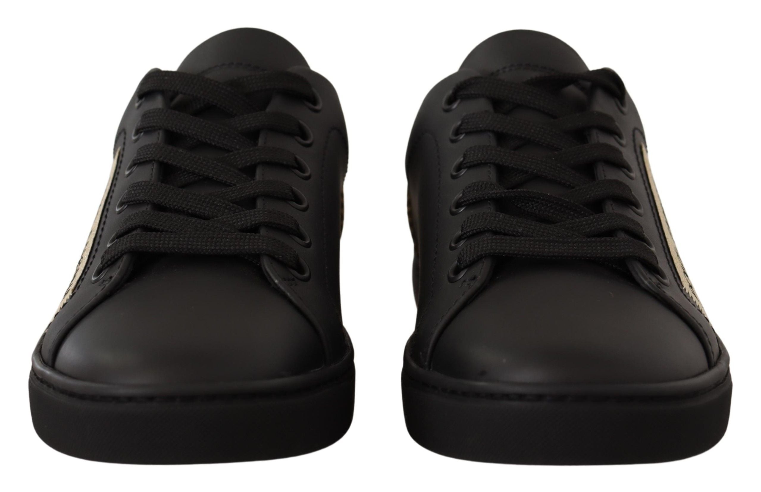 Chaussures basses pour femmes Dolce & Gabbana en cuir noir avec détails dorés, sneakers élégants et tendance.