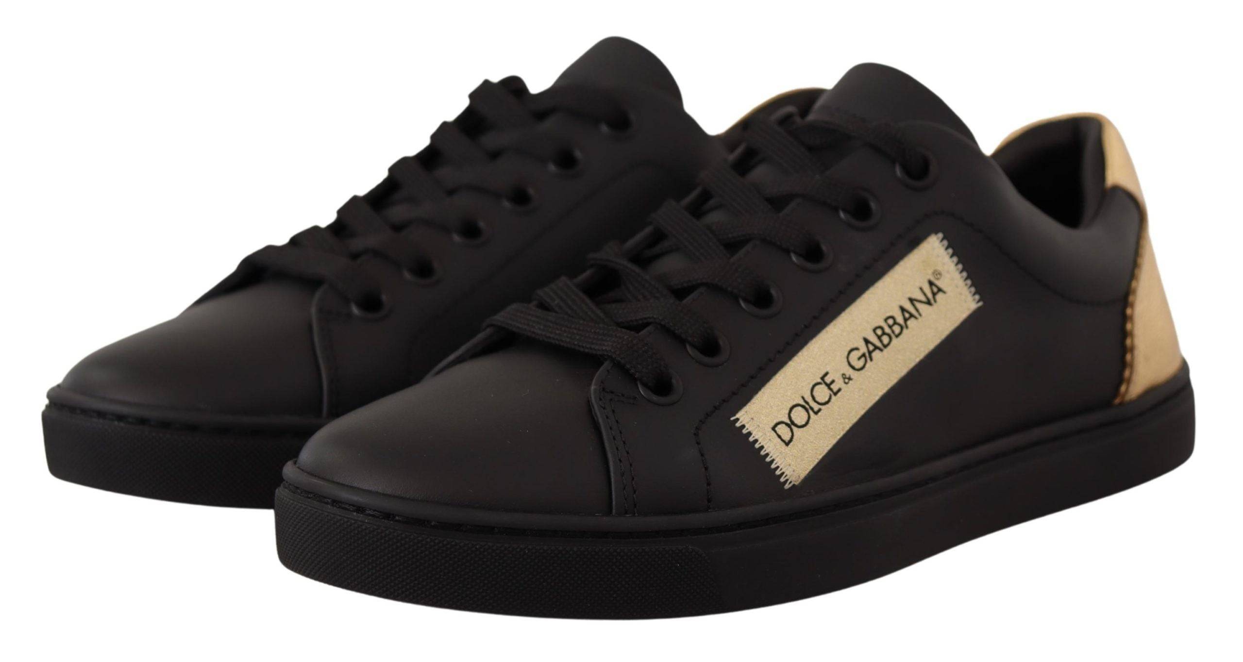 Chaussures basses pour femmes Dolce & Gabbana en cuir noir et or, sneakers décontractés avec détails élégants.