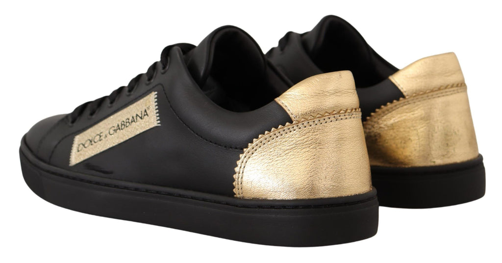 Chaussures basses Dolce & Gabbana en cuir noir et or pour femmes, sneakers élégants avec détails brillants.