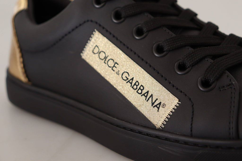 Chaussures basses pour femmes Dolce & Gabbana en cuir noir avec détails dorés, sneakers élégants et tendance.