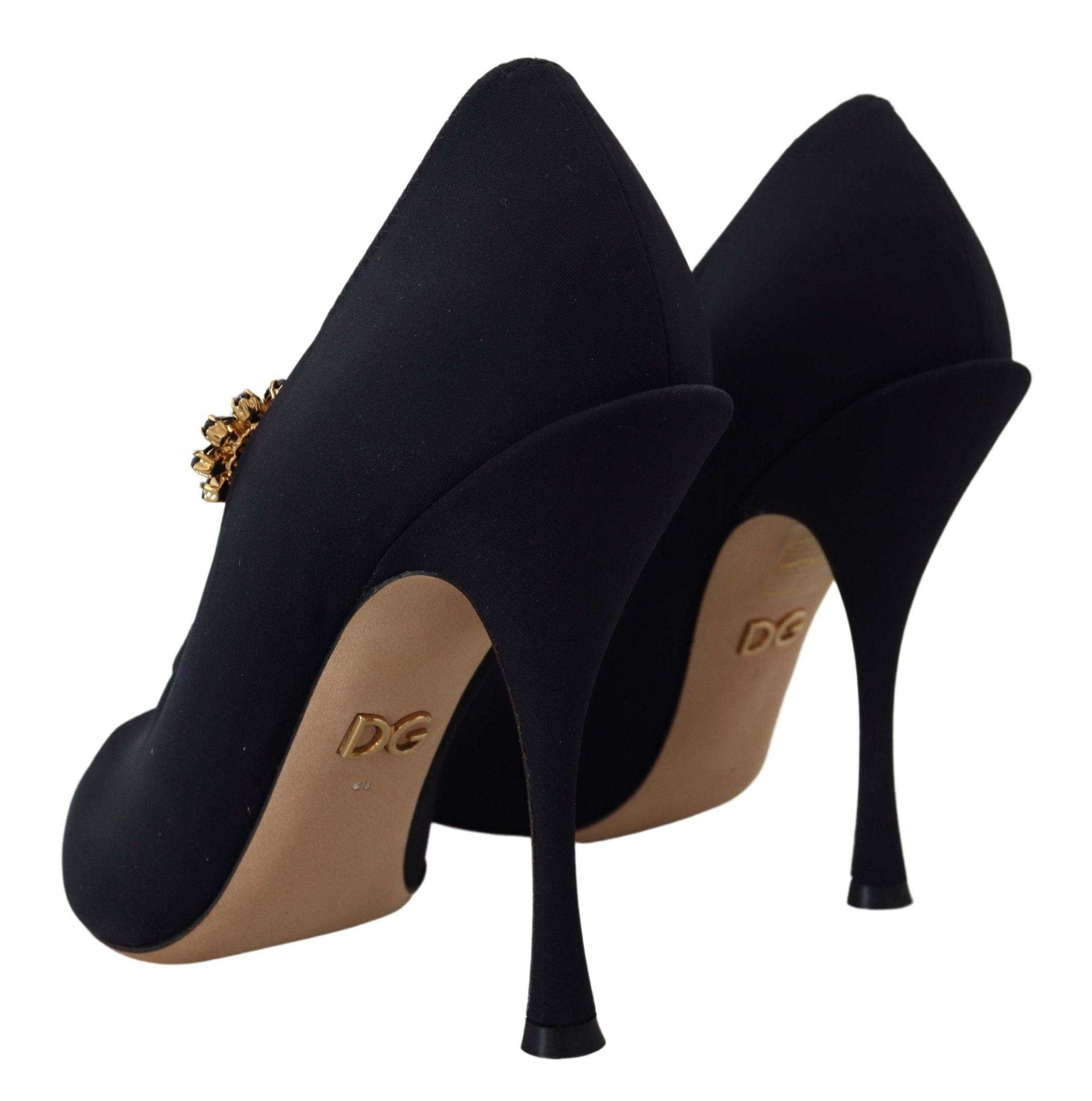 Chaussettes noires Dolce & Gabbana avec détails en cristal et talons pumps élégants en cuir.