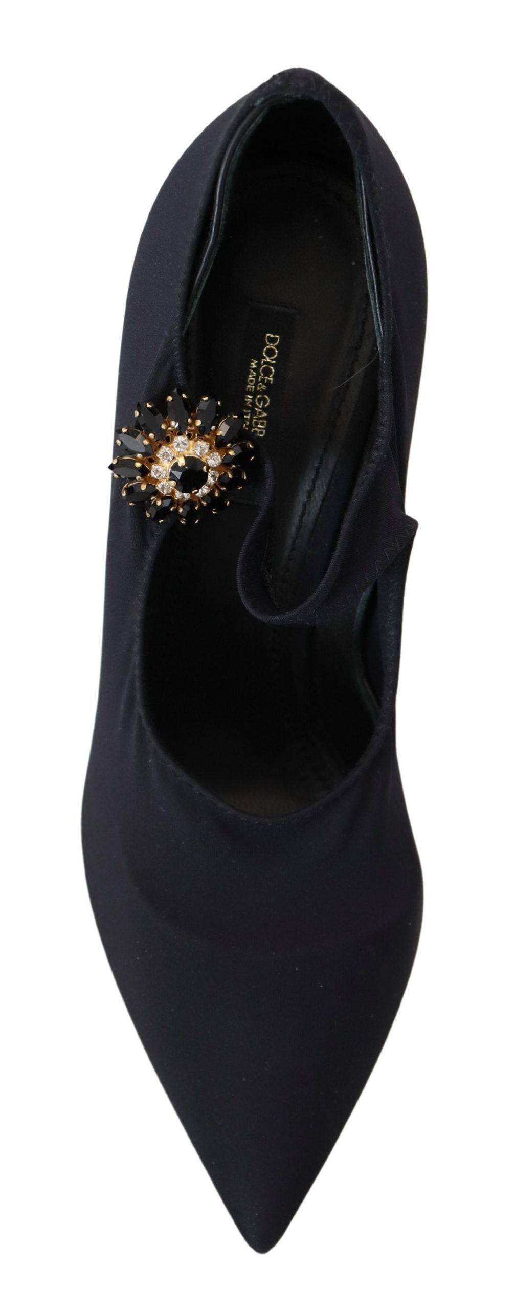 Chaussettes noires Dolce & Gabbana avec cristaux, associées à des escarpins en satin noir et cristaux.