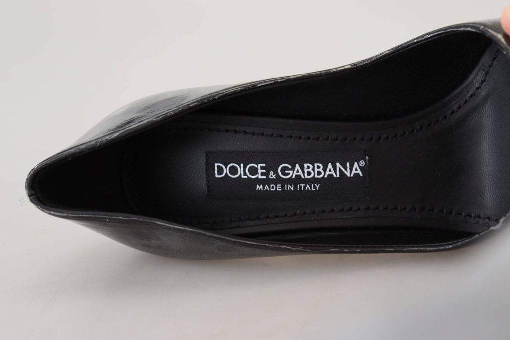 Escarpins en cuir noir de Dolce & Gabbana, chaussures à talons élégantes enveloppées de plastique, vue de face.