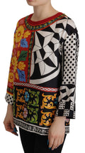 Chemise longue à manches longues Dolce & Gabbana, imprimé baroque multicolore, style décontracté et élégant.
