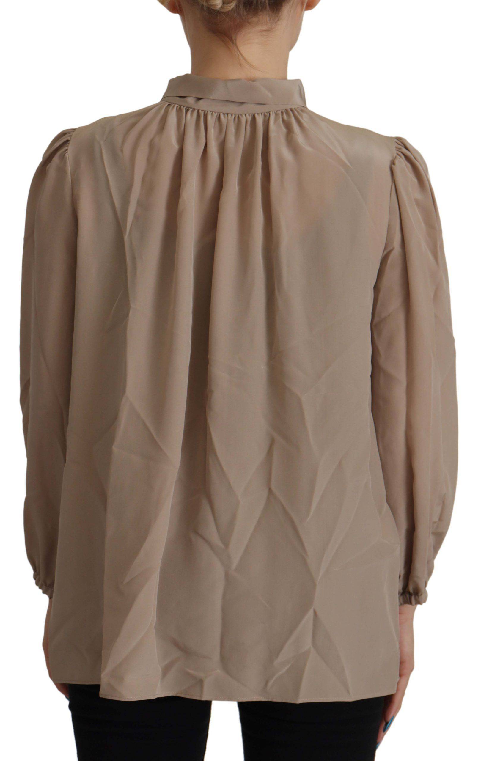 Blouse Dolce & Gabbana en brun avec col ascot, manches à bandeau à la taille, style élégant et sophistiqué.