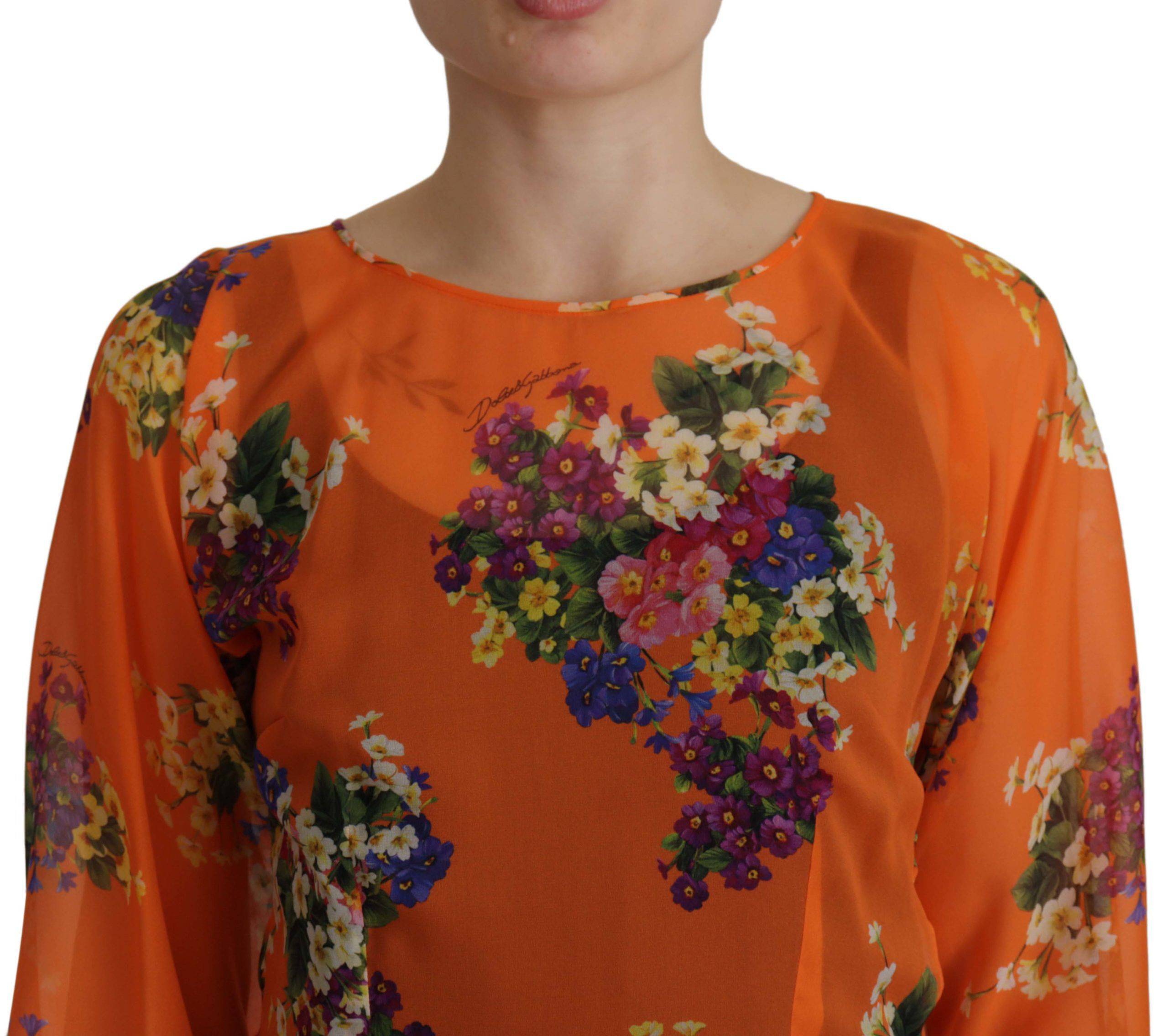 Chemisier à manches longues Dolce & Gabbana avec motif floral orange, tissu léger et coupe élégante.