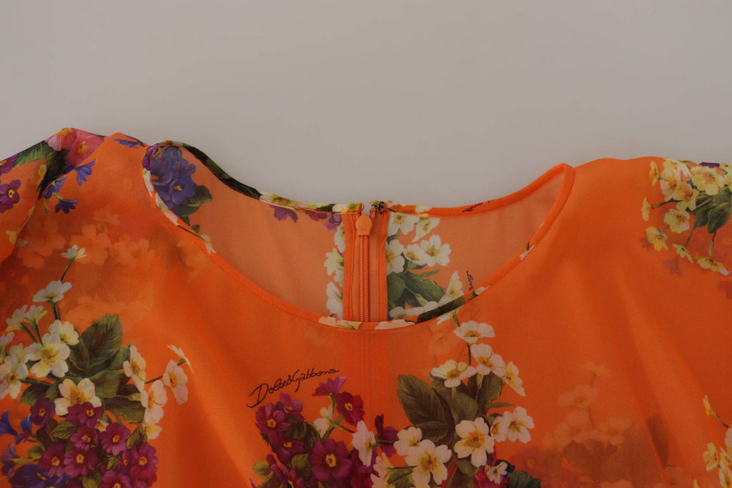 Blouse à manches longues Dolce & Gabbana avec imprimé floral orange, tissu léger et coupe élégante pour un style sophistiqué.