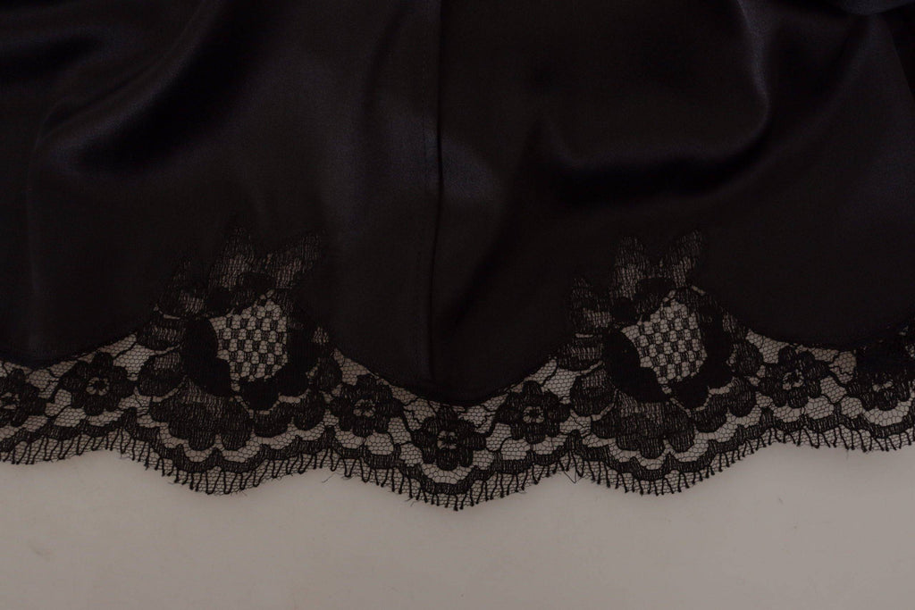Robe noire Dolce & Gabbana à motif léopard, coupe évasée, longueur au genou, élégante et sophistiquée.