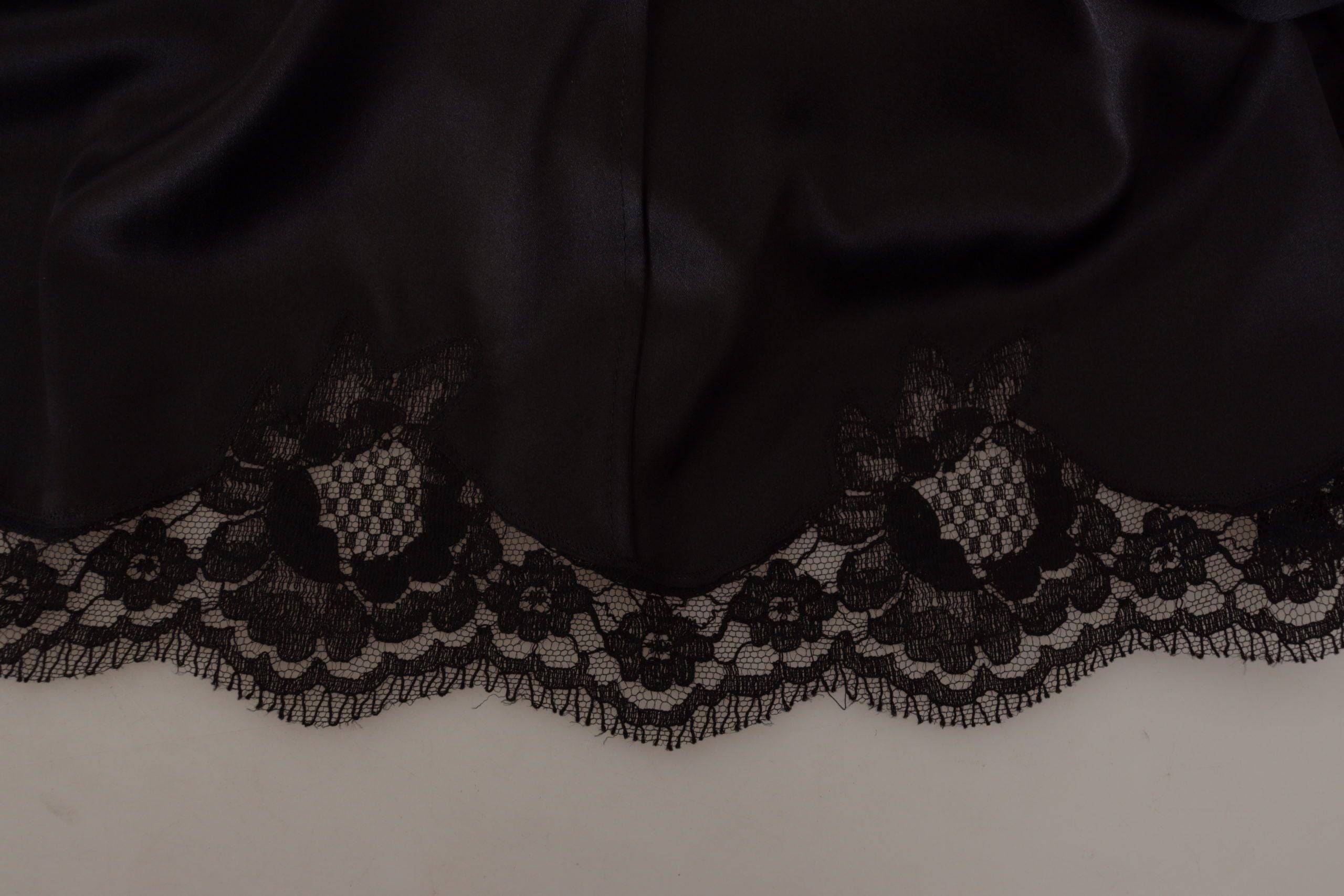 Robe noire Dolce & Gabbana à motif léopard, coupe évasée, longueur au genou, élégante et sophistiquée.