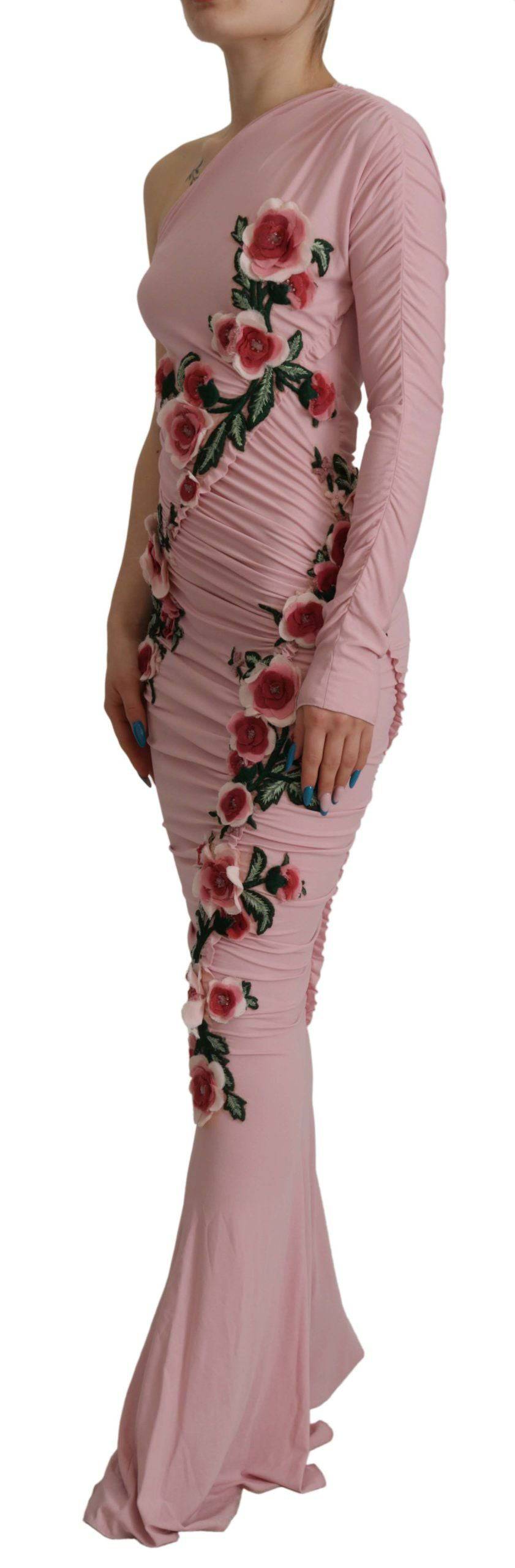 Robe rose à une épaule Dolce & Gabbana avec embellissements floraux, élégante et fluide, portée sur mannequin.
