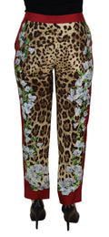 Pantalon Dolce & Gabbana à la taille moyenne avec motif léopard multicolore et imprimé floral, pantalon tendance pour femmes.