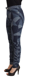 Jeans slim taille haute Dolce & Gabbana en denim bleu à fleurs, montrant la coupe ajustée et les détails floraux.
