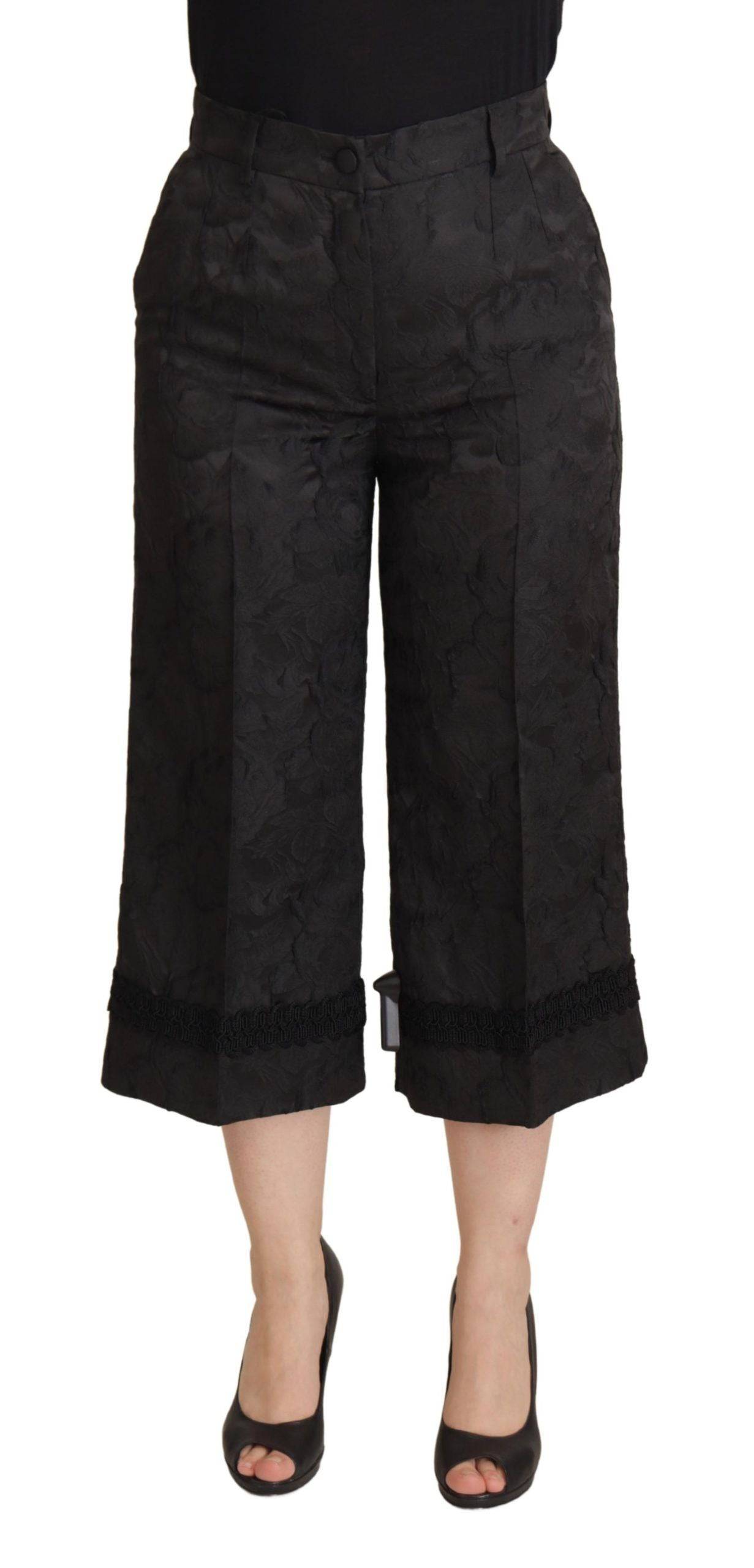 Pantalons noirs Dolce & Gabbana en brocart, coupe cropped à taille haute, élégants et sophistiqués.