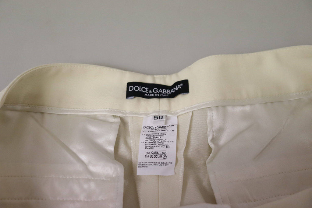 Pantalons Dolce & Gabbana ivoire à taille haute, coupe cropped avec ourlet plissé, style élégant et moderne.