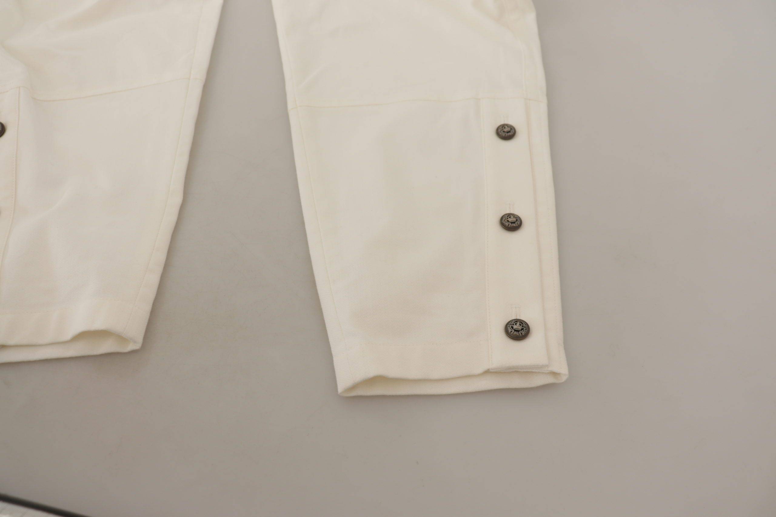 Pantalons pour femmes Dolce & Gabbana en coton blanc taille haute et coupe tapered, vues de face sur fond blanc