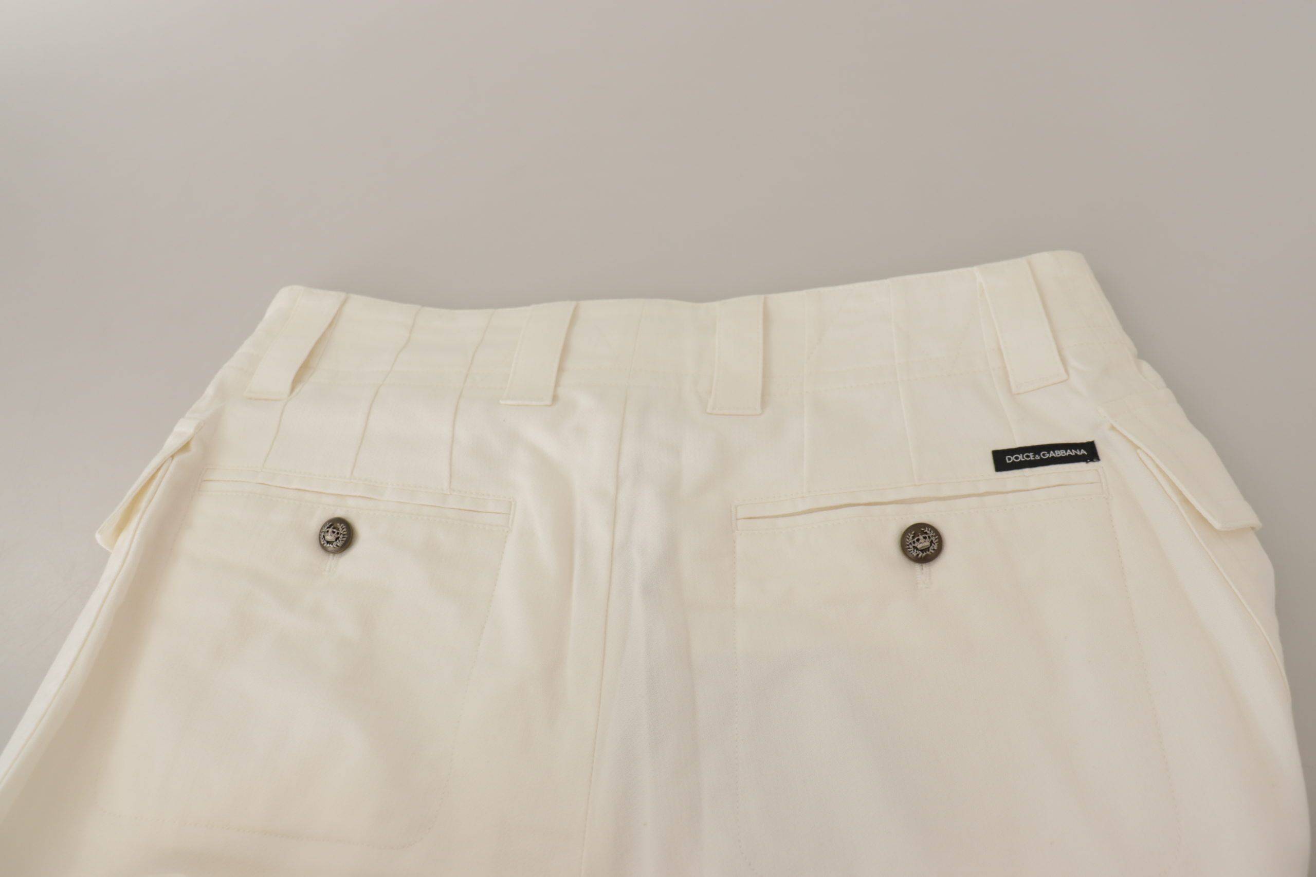 Pantalons femme Dolce & Gabbana en coton blanc à taille haute et coupe tapered, visibles sur cette image.