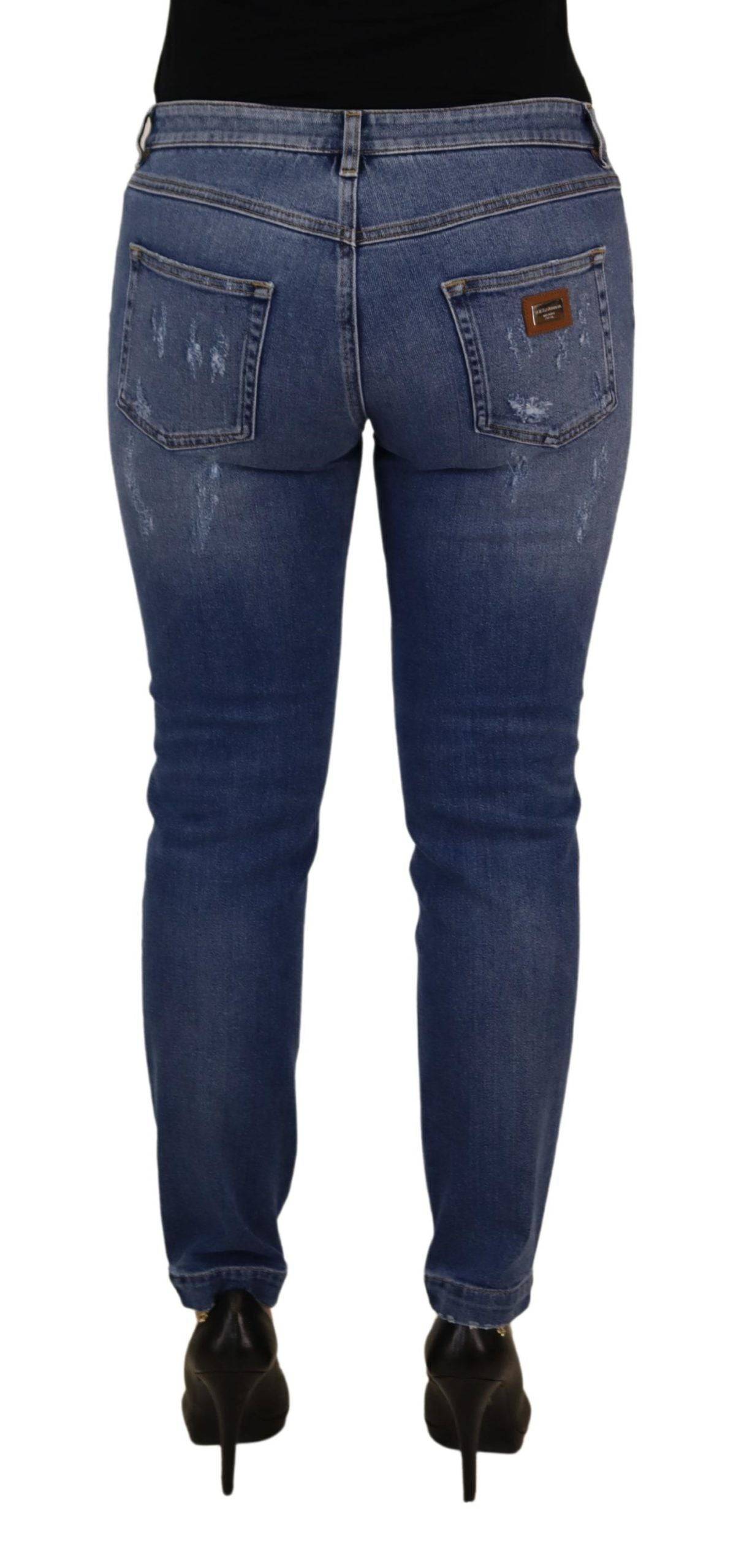 Jeans skinny en denim bleu délavé Dolce & Gabbana à taille basse, coupe ajustée et détails classiques.