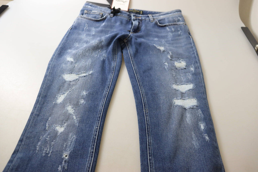 Jeans skinny en coton bleu délavé de Dolce & Gabbana, taille basse, avec coupe ajustée et détails classiques.