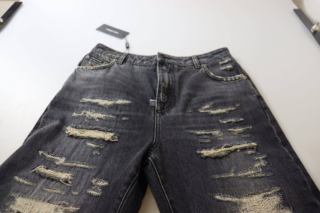 Jeans en denim noir délavé et déchiré à taille haute de Dolce & Gabbana, style décontracté et tendance.