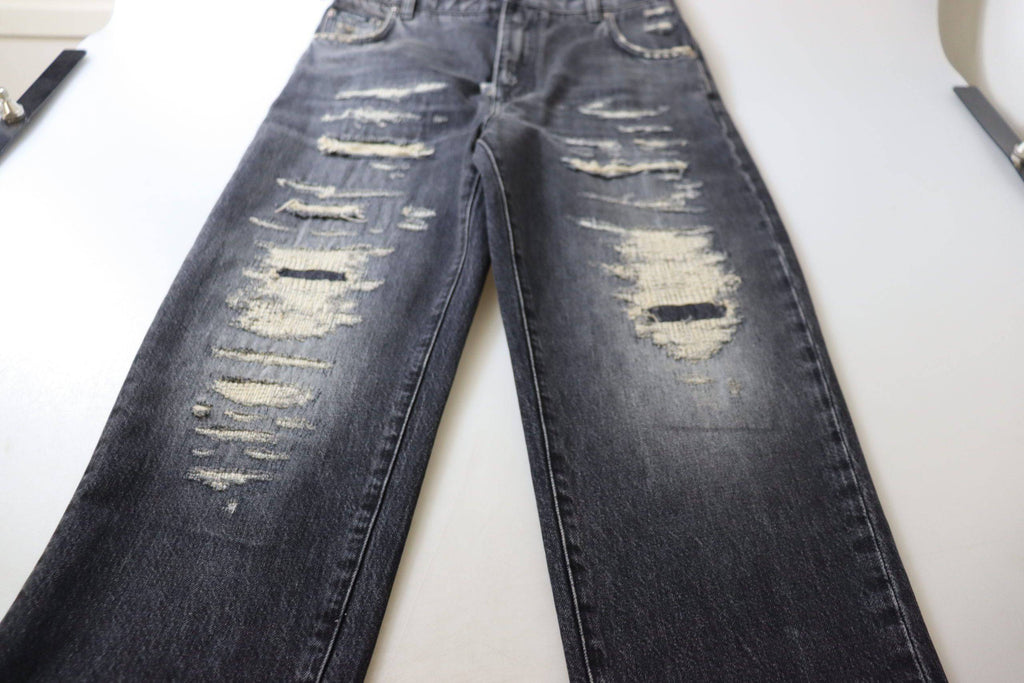 Jeans en denim noir délavé et déchiré à taille haute de Dolce & Gabbana, style décontracté et tendance.