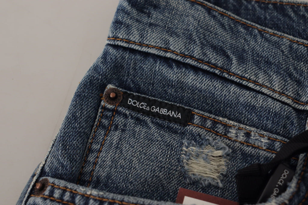 Pantalons en jean bleu Dolce & Gabbana avec logo en patch baroque et cœur, style décontracté et tendance.