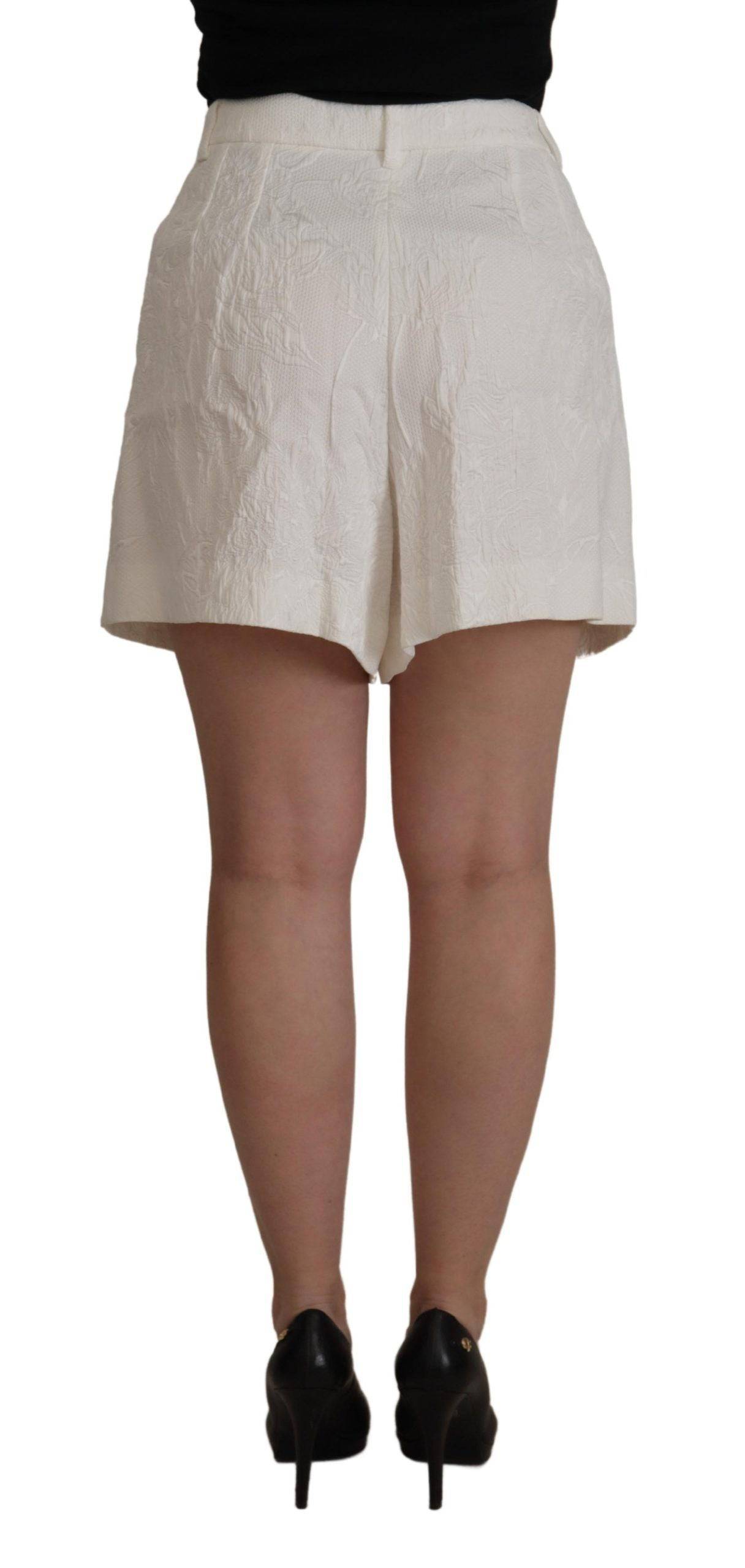 Shorts Dolce & Gabbana en coton blanc à taille haute, style culotte, visibles sur un fond neutre.