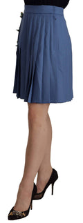 Jupe plissée courte en laine bleue Dolce & Gabbana avec embellissements élégants, mode sophistiquée et tendance.