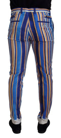 Pantalons slim en coton et soie à rayures bleues de Dolce & Gabbana, vue de face sur fond blanc.