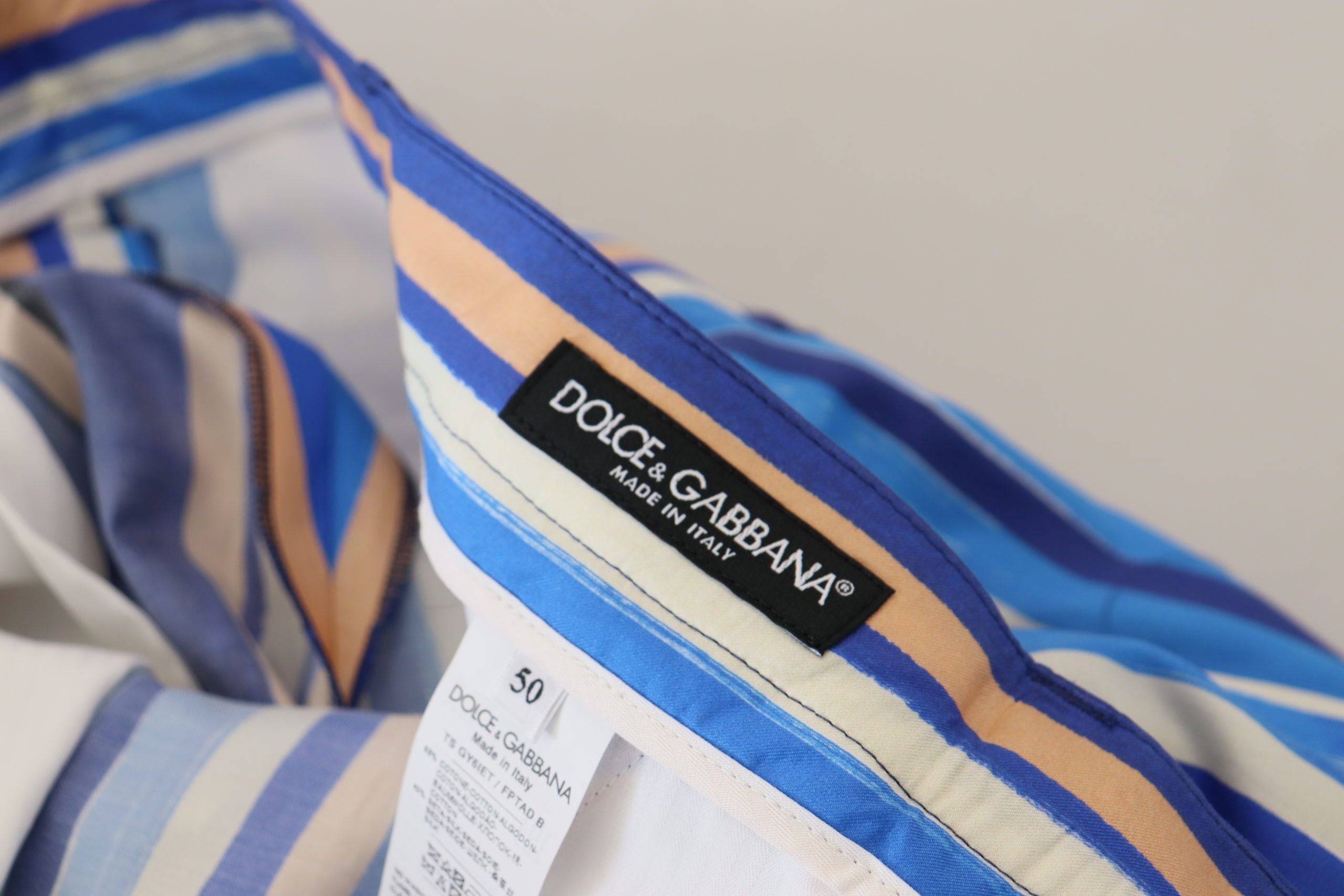 Pantalon slim Dolce & Gabbana en coton et soie à rayures bleues, élégant et ajusté pour un look chic.