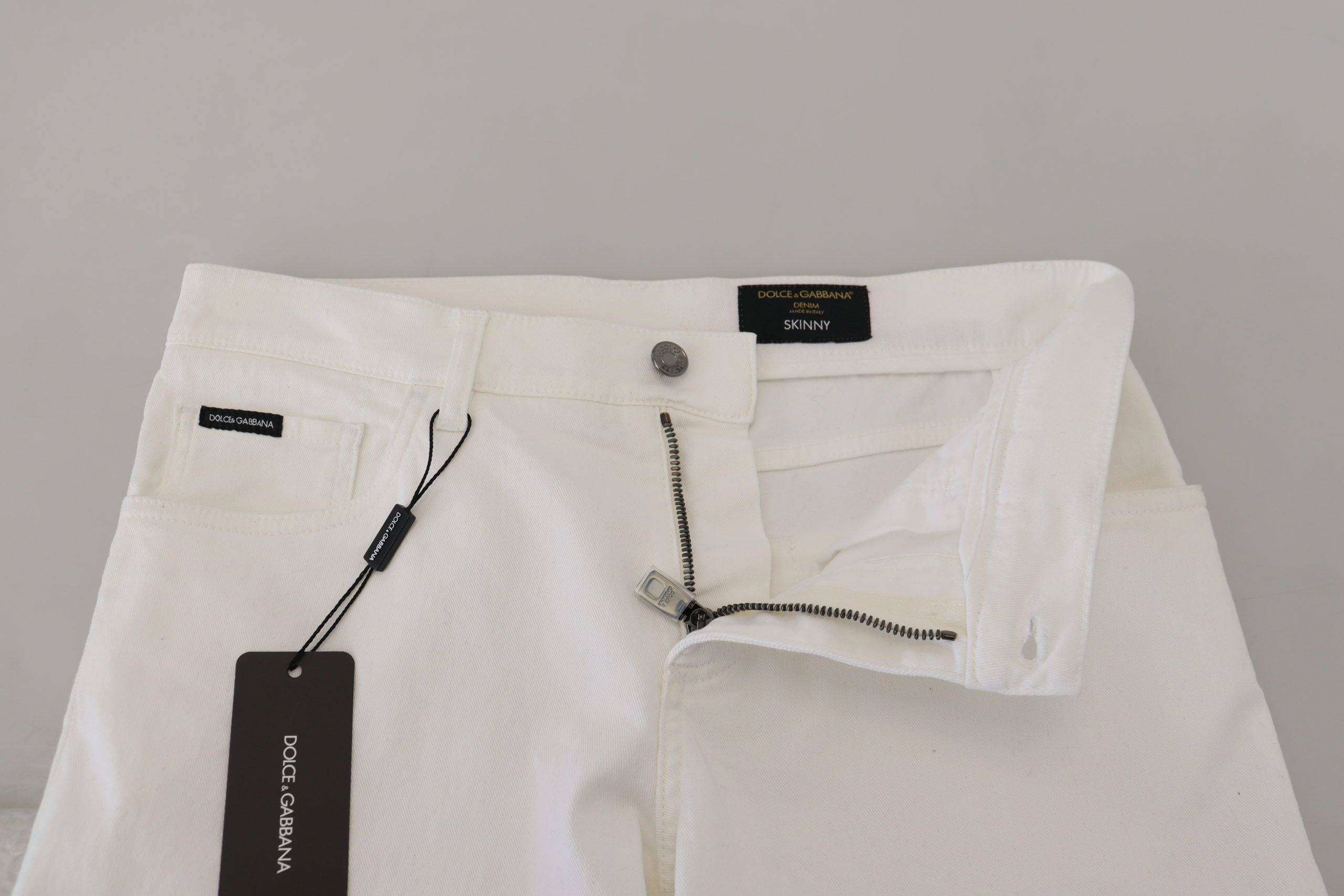 Jeans slim skinny en coton stretch blanc de Dolce & Gabbana, coupe ajustée et moderne, pour un style élégant.