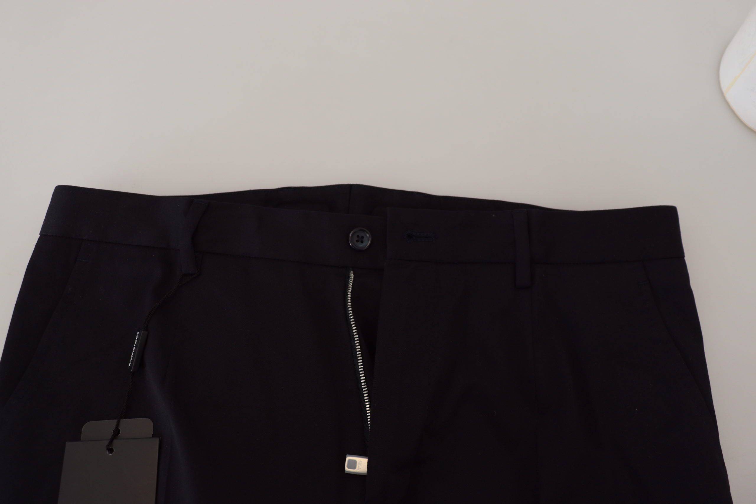 Pantalons slim en coton extensible bleu Dolce & Gabbana, style chino, vue de face sur fond neutre.