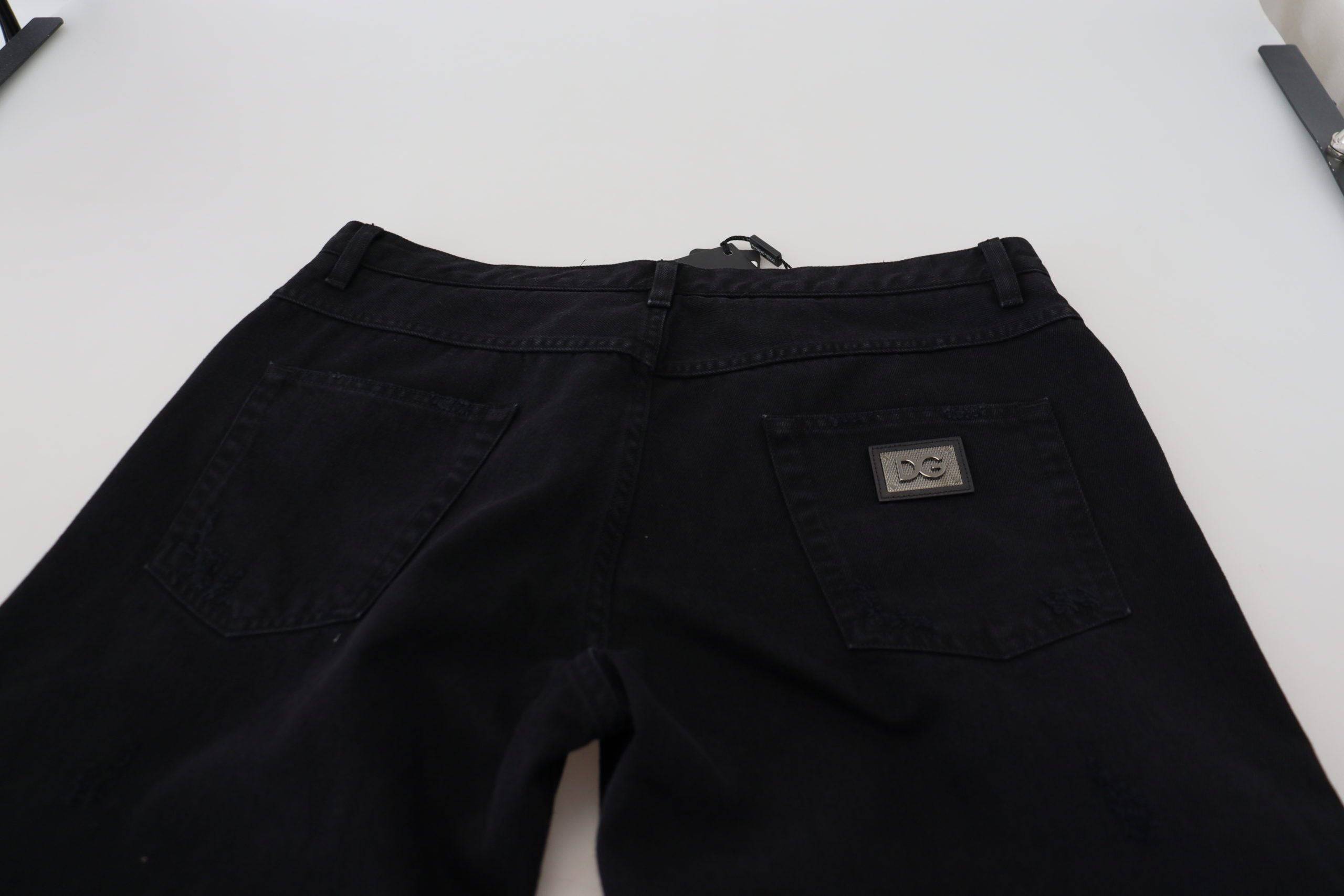 Jeans en coton noir Dolce & Gabbana, coupe ample et décontractée, avec des déchirures et un style tendance.