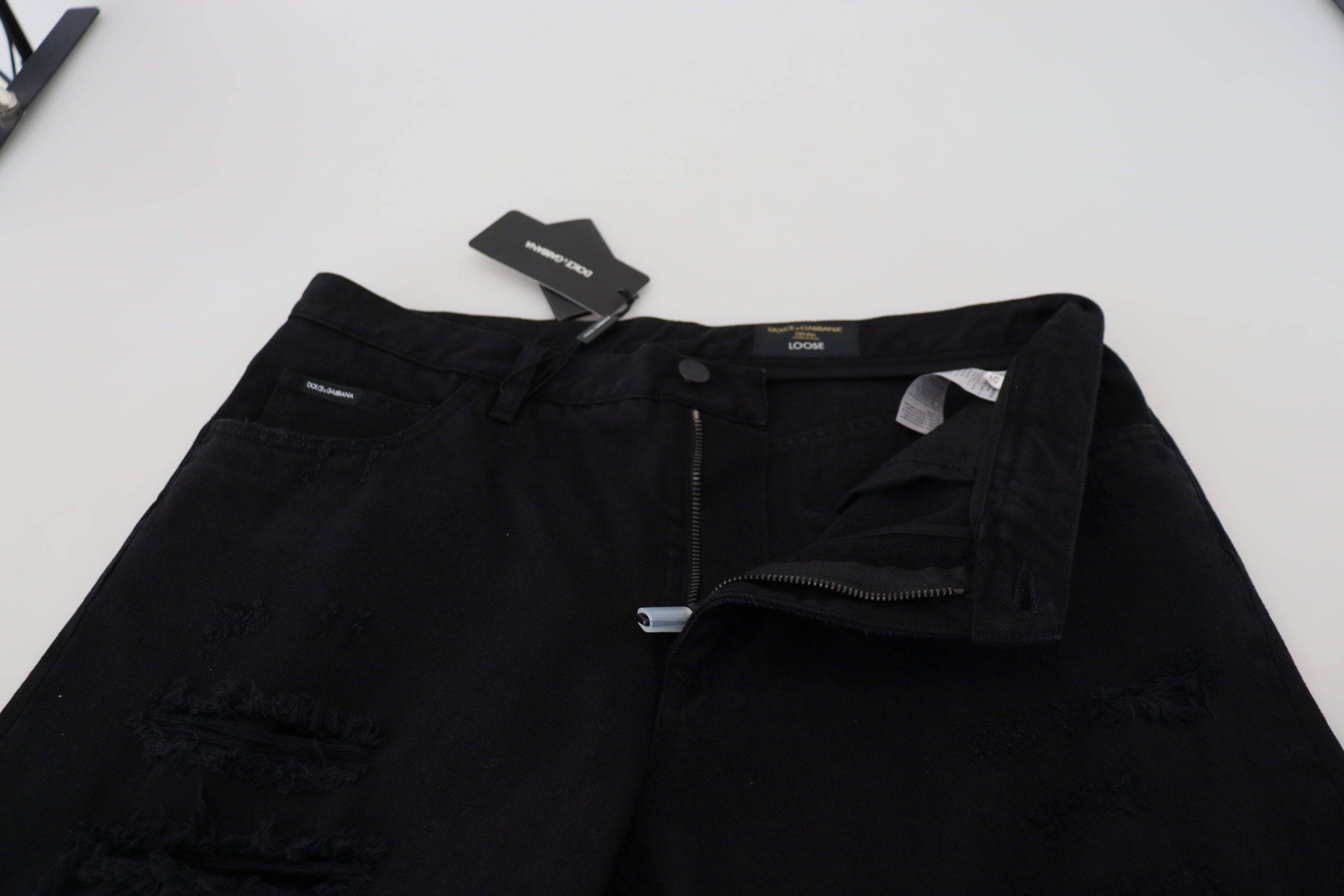 Jeans en coton noir décontractés et déchirés de Dolce & Gabbana, coupe régulière et ample, détails de style tendance.